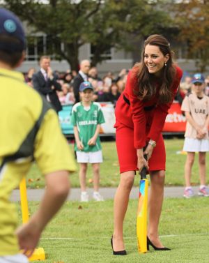 Kate Middleton playing cricket in Christchurch wearing red Luisa Spagnoli suit and heels.jpg